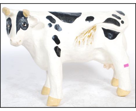 An unusual 20th century ex butchers shop large papier mache shop advertising model of a cow. Hand painted with good details. 