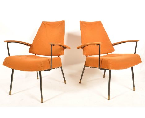 An unusual French mid Century pair of retro vintage easy / lounge chairs / armchairs having an ebonised metal and welded fram