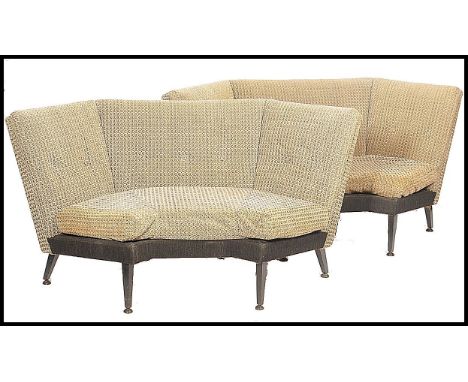 A pair of retro mid century booth style sofa settee's being upholstered in the original two tone wool fabric, the frames of w