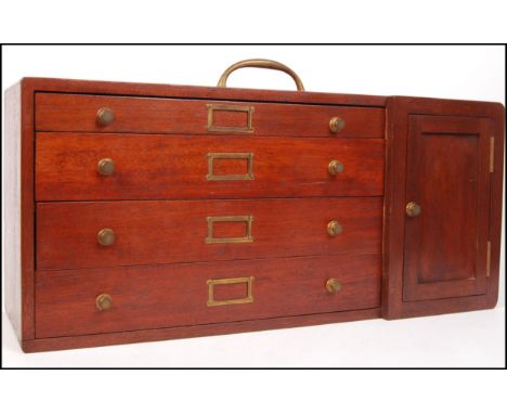 An early 20th Century vintage industrial mahogany carpenters / engineers toolbox / specimen chest having a bank of four drawe