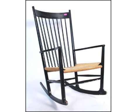 Hans Wegner - J16 chair - A mid 20th Century retro vintage ebonised&nbsp;oak rocking chair having corded seat. First introduc