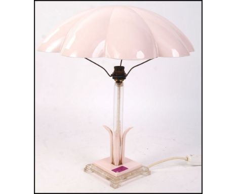 An Art Deco antique vintage table lamp having a large parachute type shade supported by a square tapering column with decorat