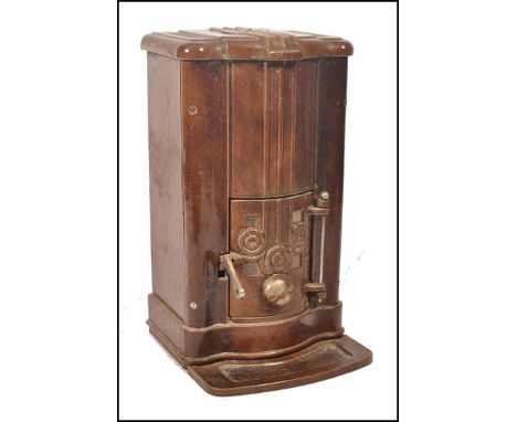 A 1930's Art Deco French enamel woodburning stove from&nbsp;Bazar de l'H&ocirc;tel de Ville which was a fashionable Paris dep