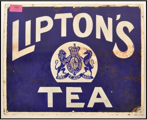 An early 20th century Lipton's Tea enamel advertising sign. Blue and white colourway with armorial crest centre with Latin no