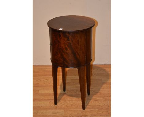 A vintage mahogany cylindrical pot cupboard, with door, raised on tapering supports, 74cm high x 38cm wide