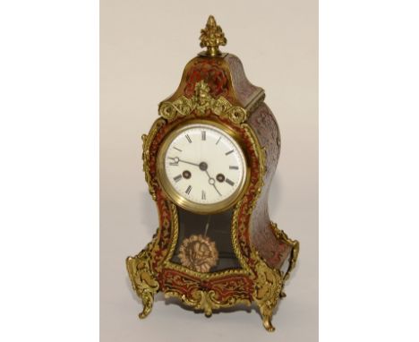 A French Louis XVI style boulle work clock, with red tortoiseshell and gilt metal mounts, enamel dial with Roman numerals, th