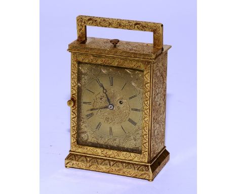 A French brass carriage clock, the dial with Roman numerals, richly decorated with allover etched foliate panels, with carry 