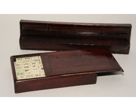 A boxed Chinse Mah-Jong set, with bone bamboo playing tablets, with four tablet rests CONDITION REPORT: Lot 230 - surface mar