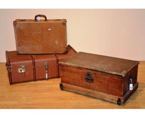 A vintage pine blanket chest, with hinged top and metal carry handles, 35cm high x 80cm wide, also with vintage travel trunk 