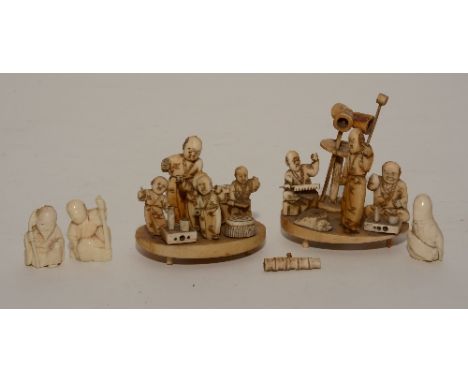 Three Japanese ivory netsuke's, carved as figures of elderly gentleman, 4cm high, together with two Japanese carved bone figu