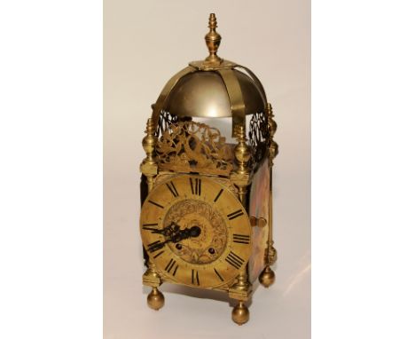 A 17th century and later brass lantern clock, the bell above chapter ring with Roman numerals, etched detail to the centre, p