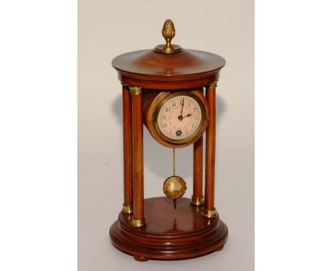 A French stained walnut four pillar mantel clock, with cast brass pineapple finial, drum cased pendulum driven movement set b