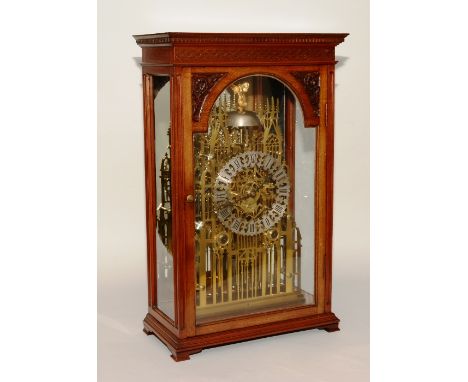 A fine brass twin fusee cathedral skeleton clock, of large form with 8" pierced chapter ring with Roman numerals, on a twin f