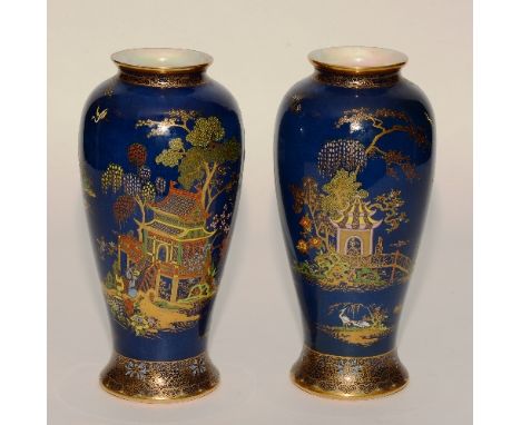 A pair of Carlton Ware 'New Mikado' pattern vases, decorated in rich coloured enamels, with gilded border on blue ground, 27c