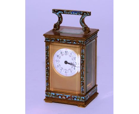 A late 19th century French champleve enamel and brass carriage clock, the enamel dial with Arabic numerals and minute track, 