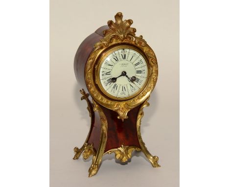 A French Louis XVI style red tortoiseshell and gilt metal mantel clock, indistinctly signed to the dial possibly retailed by 