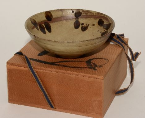 A Chinese brown stoneware bowl, unmarked to base, but with Chinese leaflet enclosed, in wooden box, 21cm diameter