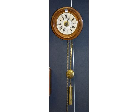 A vintage mahogany framed circular wall clock, dial 17.5cm diameter, with two brass weights and pendulum, 30cm high