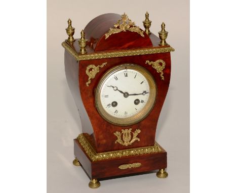 A 19th century French Louise XVI style red tortoiseshell and ormolu mantel clock, with four gilt metal urn finials to the top