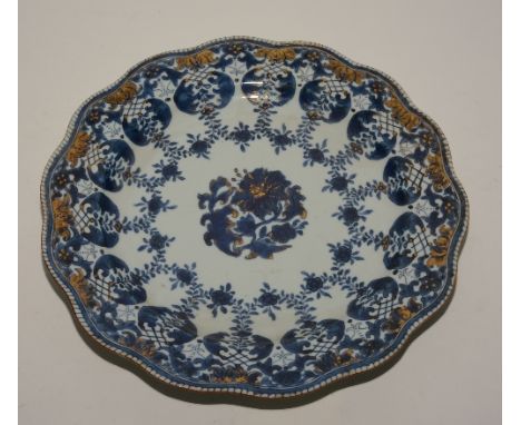 A Chinese circular porcelain charger from the Kangxi Period circa 18th century, decorated with European inspired blue polychr