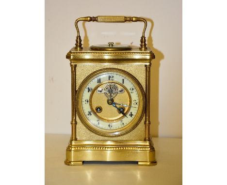 A 19th century French gilt metal mantel clock with integral aneroid barometer, in the form of a carriage clock, with aneroid 