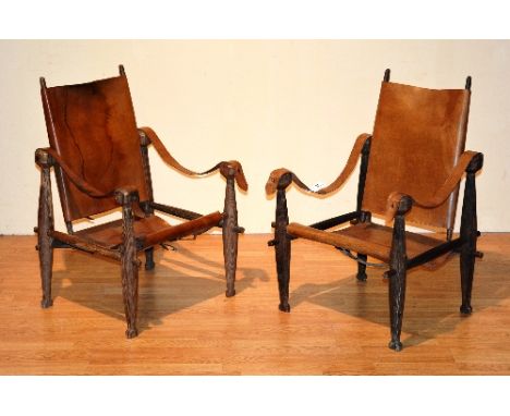 A pair of vintage African officers chairs, with removable tan leather back rests and seats, 86cm high CONDITION REPORT: Lot 5