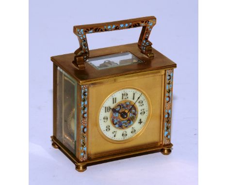 A late 19th century French champleve enamel and brass carriage clock, the enamel dial with Arabic numerals, foliate champleve