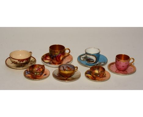 A Royal Worcester cabinet cup with saucer signed by Jas Stinton circa 1920's, decorated with pheasant and owl, cup 3cm high, 