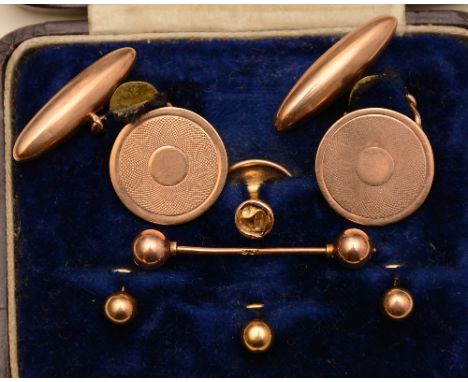 A pair of 9ct gold cufflinks, the round ends with engine turned decoration, stamped 9ct R&S to underside, 7.7g, together with