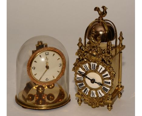 A French brass mantel clock in the form of a 17th century lantern clock, with cockerel surmount on bell and fret, the dial wi