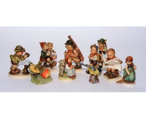A collection of Hummel figurines, together with a Royal Worcester 'Great Tit' and a Border Fine Arts 'Blue Tit' (10)