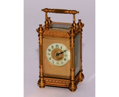 A late 19th century French brass carriage clock, the carry handle above cream enamel dial with Arabic numerals, 16cm high, wi