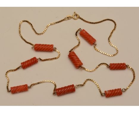 A 9ct gold and coral necklace, the fine brick link chain set with eight twists of coral, stamped 375 to chain, 61cm long (unf