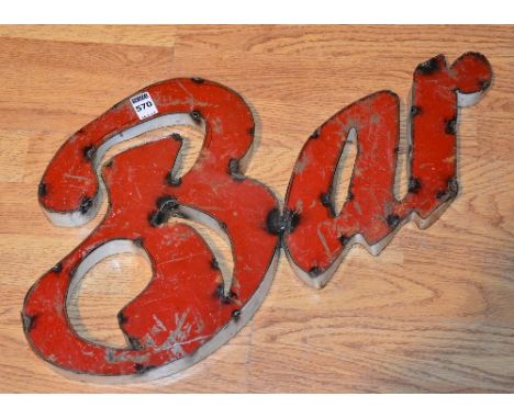 A tin bar sign, 32cm high x 57cm wide  CONDITION REPORT: 570 - Tin, the item is a reproduction.