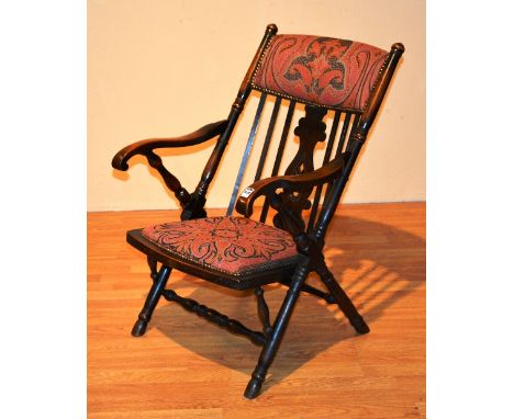 A vintage rail back armchair, with later upholstered stuffover seat and back rest, 84cm high