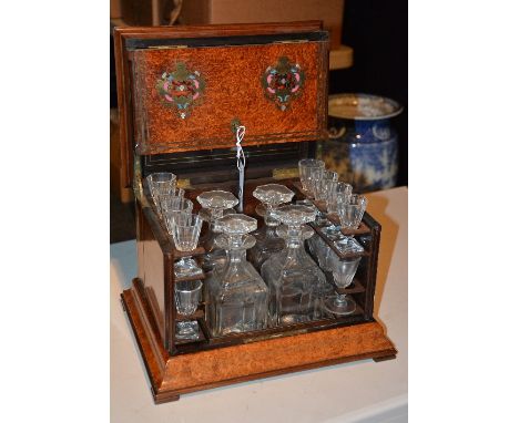 A good quality 19th century figured walnut decanter box with contents, the hinged top opening to reveal fitted interior conta