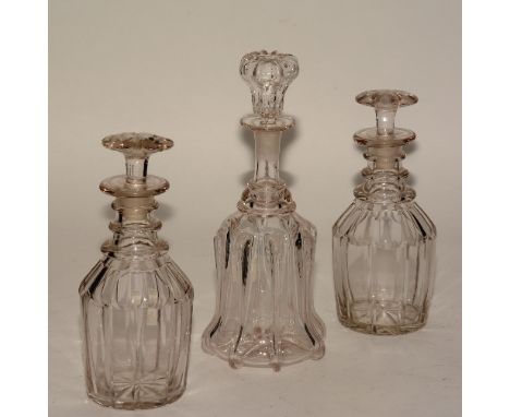 A pair of 19th century mallet shaped glass decanters, with flat mushroom head stopper, ring neck, faceted body, 26cm high, al