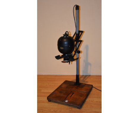 A vintage Leitz photo enlarger with Zeiss Tessar lens, raised on plinth, 103cm high