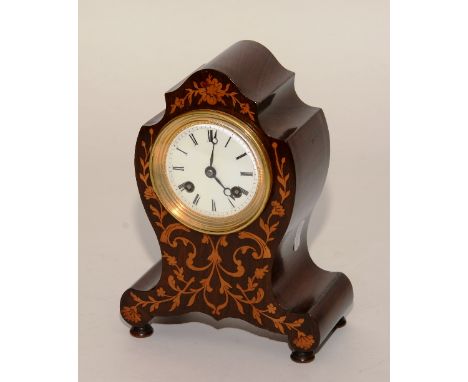 A late 19th century rosewood and satinwood inlaid lancet mantel clock, probably of French origin, the enamel dial with Roman 