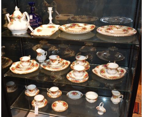 A quantity of Royal Albert 'Old Country Roses' teawares, 36 pieces, also with a pair of Coalport porcelain candlesticks and a