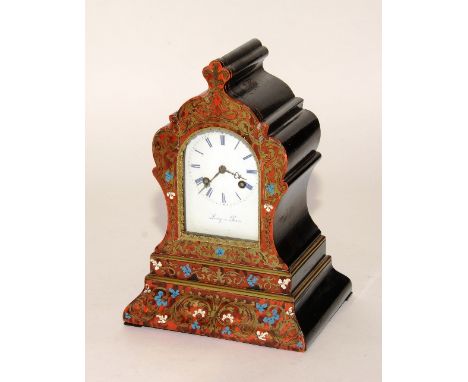 A French Louis XVI style boulle work mantel clock by Leroy of Paris, having red tortoiseshell case with brass foliate and blu
