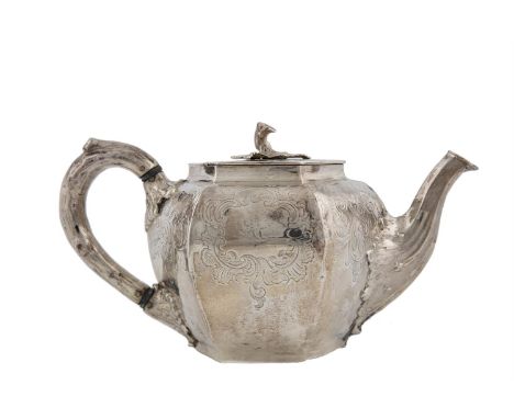 A WILLIAM IV IRISH SILVER TEAPOT, Dublin 1831, mark of William Nowlan, of melon form with six panel sides, having hinged lid,