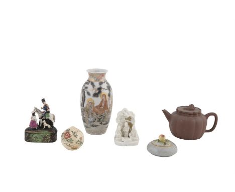 A COLLECTION OF CHINESE AND JAPANESE PORCELAINS, comprising a small 'blanc de chine' group of young boys playing 'go', seated