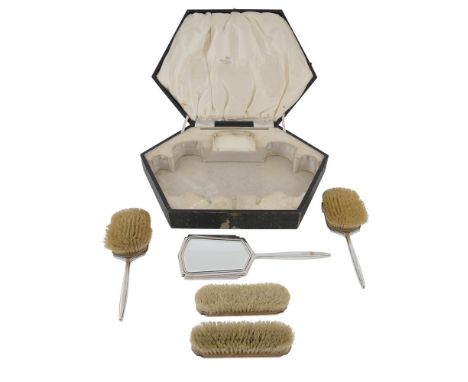 AN ART DECO FIVE-PIECE SILVER HANDLE VANITY SET, Sheffield 1938, mark of Walker and Hall, comprising a large silver backed ha