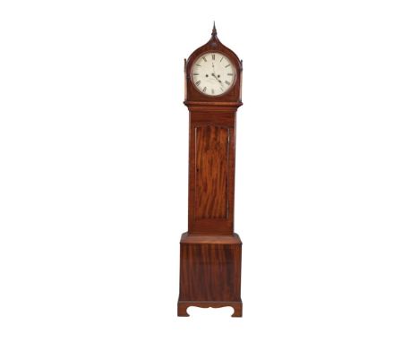 A VICTORIAN MAHOGANY LONGCASE CLOCK BY DOBBYN OF DUBLIN, the arched hood with gothic motifs and an inscribed painted dial abo