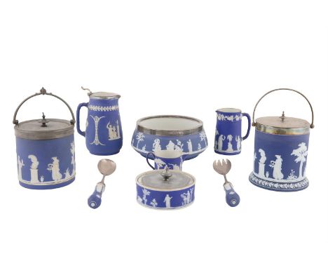 A COLLECTION OF WEDGEWOOD BLUE JASPERWARE PIECES, including a circular salad bowl and servers, two biscuit barrels, three jug