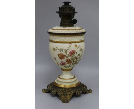 A Royal Worcester floral painted blush ground oil lamp height 42cm