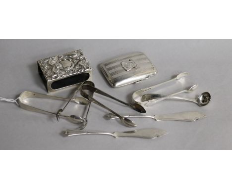 A silver cigaretter case, a silver match sleeve, a pair of silver butter knives, four pairs of silver sugar tongs and a silve