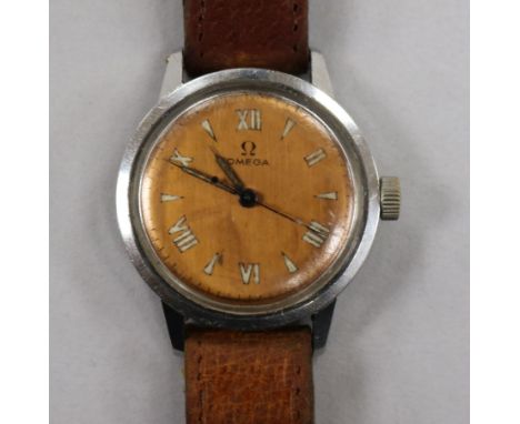 A gentleman's early 1940's stainless steel Omega manual wind wrist watch with copper coloured dial.