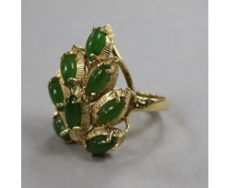 A modern 14ct gold and cabochon jade set cocktail ring, size N.